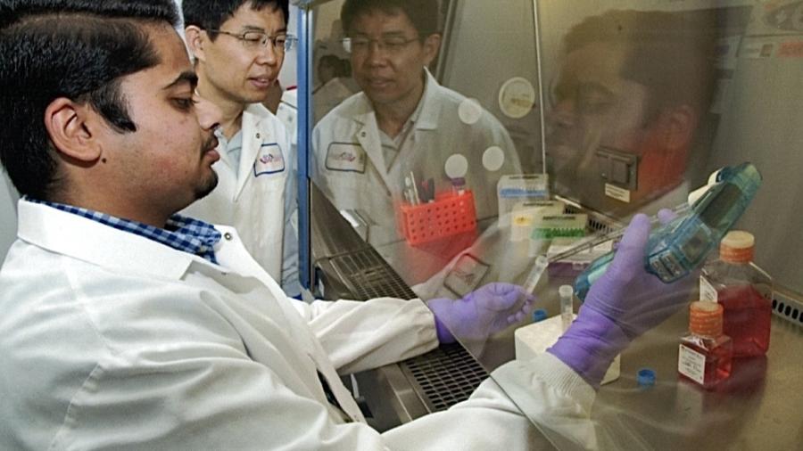 Nabhan Fakrudin with Dr. Jian Gu working in a lab