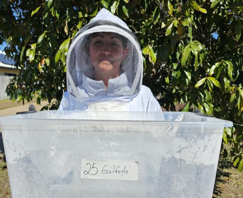 Beth Ponn wearing a bee suit to protect her from ants