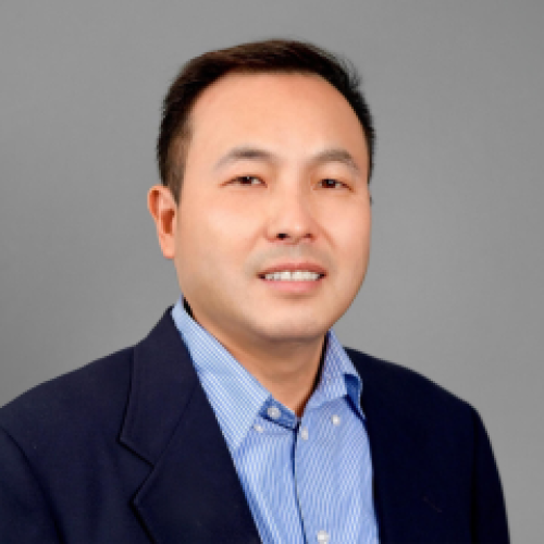 headshot of Qiang Chen wearing a blue button down shit and black blazer